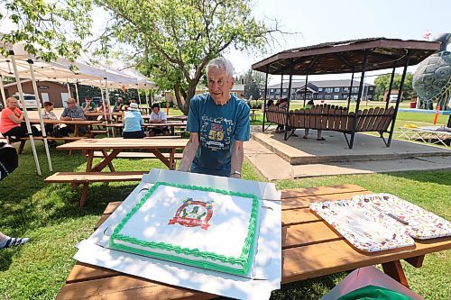 Wayne Pringle, one of the pioneer organizers of the turtle races that put Boissevain on the map, with Tommy Turtle's 50th Birthday Cake at the Tommy Turtle site on Saturday. Photos: Abiola Odutola/ The Brandon Sun