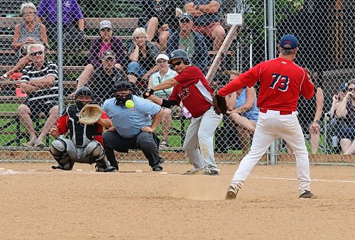 Borderline Legends first baseman Craig Zamzow stretches to catch the ball on a close play to put out Onanole Sporty&#x2019;s Originals batter Chris Hanson (8) under the watchful eye of pitcher Terry Peppler (73) during the inaugural 50-plus Softball Manitoba masters championship in Onanole on Sunday afternoon. The Originals earned a hard-fought 8-7 victory. (Perry Bergson/The Brandon Sun)
July 14, 2024