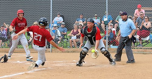 Onanole Sporty&#x2019;s Originals base runner Scott Stephenson slides into the plate safely in the fourth inning as Borderline Legends catcher Brad Zimmer (2) catches the ball under the watchful eye of on-deck hitter Dan Fedak (34) and umpire Brad DeGraeve during the inaugural 50-plus Softball Manitoba masters championship in Onanole on Sunday afternoon. The Originals earned a hard-fought 8-7 victory. (Perry Bergson/The Brandon Sun)
July 14, 2024