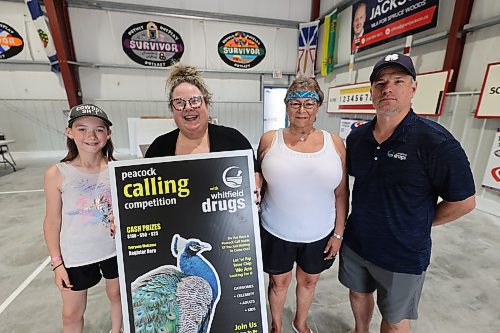 Peacock Calling Competition Young winner Enne Ross, 11, (left to right) organizer Monique Perey, adult category winner Joanne Butler and Whitfield Drugs owner Colin McLeod pose for a picture after the competition at Souris Community Hall on Saturday. (Abiola Odutola/The Brandon Sun)