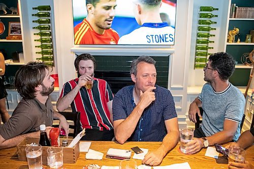 BROOK JONES / FREE PRESS
Joel Boulet (second from far right) reflects on the Euro Cup final between England and Spain. Boulet watched the match with his sons Joe (left) and Sam (second from far left) and their friend Trevor Martin (right) on the TVs at the Elephant & Castle in Winnipeg, Man., Sunday, July 14, 2024.