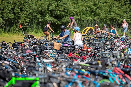 BROOK JONES / FREE PRESS
Folk Fest goers park their bikes as they arrive at the 49th Winnipeg Folk Festival at Birds Hill Provincial Park in Man., Sunday, July 14, 2024.