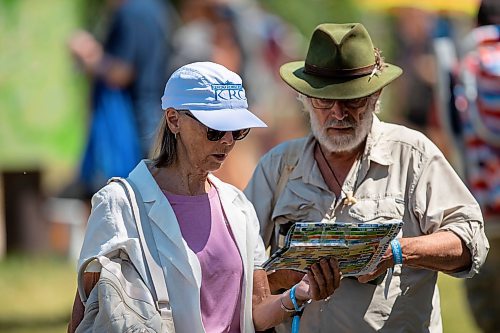 BROOK JONES / FREE PRESS
Folk Fest goers check out the site map at the 49th Winnipeg Folk Festival at Birds Hill Provincial Park in Man., Sunday, July 14, 2024.