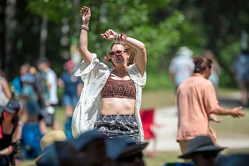 BROOK JONES / FREE PRESS
Folk Fest goer Michelle Bedford, who lives in Bemidji, Minn., dances to music by Inn Echo Tech Rider at the Snowberry Field stage at the 49th Winnipeg Folk Festival at Birds Hill Provincial Park in Man., Sunday, July 14, 2024. It was Bedford's second time attending Folk Fest.