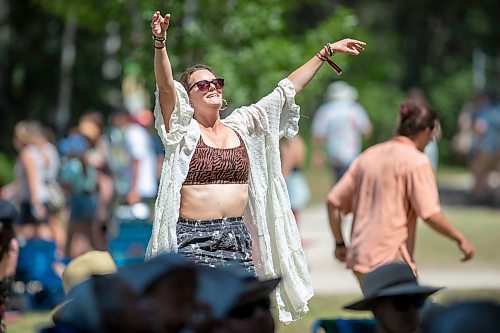 BROOK JONES / FREE PRESS
Folk Fest goer Michelle Bedford, who lives in Bemidji, Minn., dances to music by Inn Echo Tech Rider at the Snowberry Field stage at the 49th Winnipeg Folk Festival at Birds Hill Provincial Park in Man., Sunday, July 14, 2024. It was Bedford's second time attending Folk Fest.