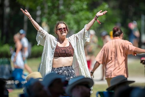 BROOK JONES / FREE PRESS
Folk Fest goer Michelle Bedford, who lives in Bemidji, Minn., dances to music by Inn Echo Tech Rider at the Snowberry Field stage at the 49th Winnipeg Folk Festival at Birds Hill Provincial Park in Man., Sunday, July 14, 2024. It was Bedford's second time attending Folk Fest.