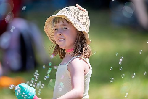 BROOK JONES / FREE PRESS
Folk Fest goer Georgia Betker having fun with her ice cream cone mini bubble blower while hanging out at the Snowberry Field stage area at the 49th Winnipeg Folk Festival at Birds Hill Provincial Park in Man., Sunday, July 14, 2024. It was the four-year-old second time attending Folk Fest.