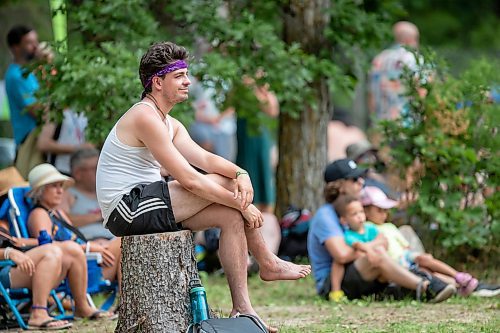 BROOK JONES / FREE PRESS
Folk Fest goer Duncan Cox, 27, who is from Winnipeg, Man., listens to Steph Strings, who is a musician based in Melbourne, Australia, perform on the Little Stage In The Forest at the 49th Winnipeg Folk Festival at Birds Hill Provincial Park in Man., Sunday, July 14, 2024.