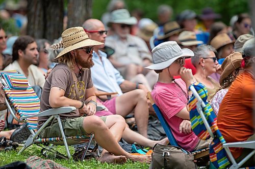 BROOK JONES / FREE PRESS
Folk Fest goer Ryan Gerband (straw hat), 45, who is from Morden, Man., listens to Steph Strings, who is a musician based in Melbourne, Australia, perform on the Little Stage In The Forest at the 49th Winnipeg Folk Festival at Birds Hill Provincial Park in Man., Sunday, July 14, 2024. Gerbrand has been attending Folk Fest for 30 years.