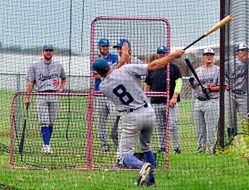 Ty Paddock (8) and his Oak River Dodgers teammates used the Elkhorn batting cage prior to their Sunday night South West Baseball League game. Leading his team with 12 RBI, Paddock added to his RBI total with two, two runs scored and two stolen bases while going 2-for-3 as the Dodgers defeated the Expos 8-3. (Jules Xavier/The Brandon Sun)