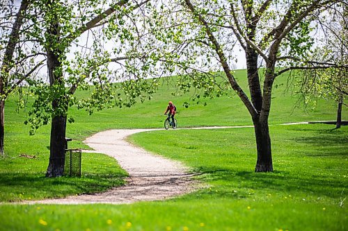 MIKAELA MACKENZIE / FREE PRESS

A cyclist rides through the vibrant green hills (made lush by recent rains) at Woodsworth Park on Friday, May 17, 2024.

Standup.

