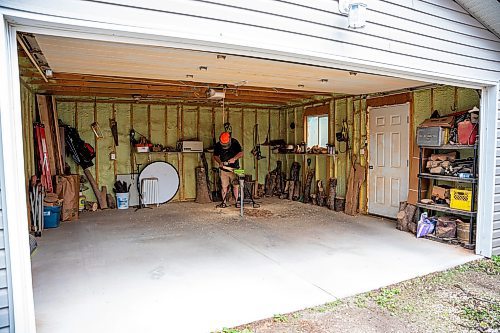 NIC ADAM / FREE PRESS
Sean Philips, 52, makes one-of-a-kind woodwork sculptures and pieces in the garage of his home from salvaged wood sourced here in MB.
240715 - Monday, July 15, 2024.

Reporter: