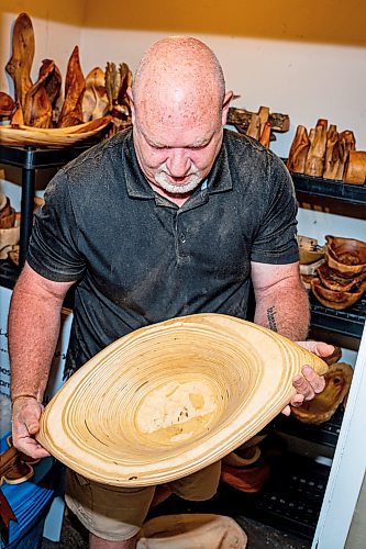 NIC ADAM / FREE PRESS
Sean Philips, 52, makes one-of-a-kind woodwork sculptures and pieces in the garage of his home from salvaged wood sourced here in MB.
Philips&#x2019; store-room in the basement of his home. This is where he stores pieces to sell at shows and events.
240715 - Monday, July 15, 2024.

Reporter: