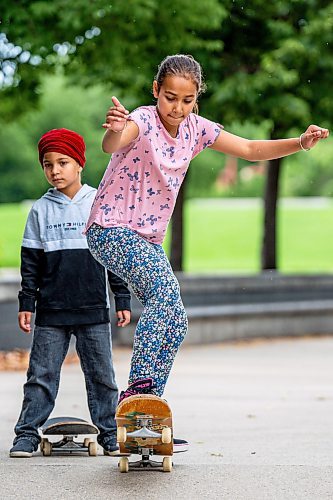 NIC ADAM / FREE PRESS
Smile Dhaliwal learns to skate at Sk8 Skates&#x2019; free skateboarding class at the Forks on Tuesday afternoon.
240716 - Tuesday, July 16, 2024.

Reporter: Zoe