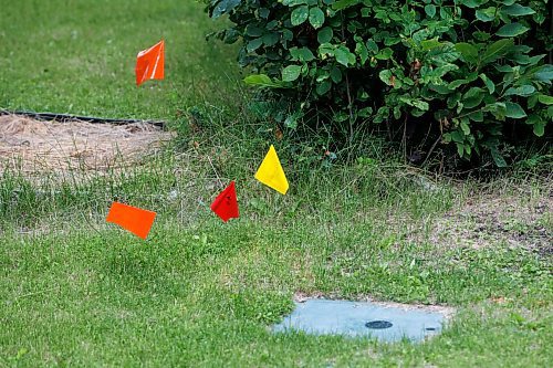 MIKE DEAL / FREE PRESS
Utility flags dot homeowners yards prior to the start of street repair.
The intersection of Augusta Drive and Greensboro Square and Bay.
The condition of the streets in Waverley Heights. Specifically Augusta Drive and Greensboro Bay, showing potholes, crumbling curbs, cracks in the pavement.

See 49.8 street construction project

240716 - Tuesday, July 16, 2024.