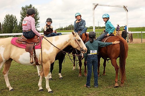 16072024
(L-R) Sadie Davis, Kylie Davis, Evelyn Burns, Adi McKenzie and Elliott Burns wait to compete in the pairs class during the light horse show at the 136th Annual Strathclair Ag Society Fair on Tuesday. The Strathclair Ag Society Fair is one of six stops for the annual Milk Run, a six day long series of town fairs in close proximity. The other fairs include Oak River, Shoal Lake, Hamiota, Harding and Oak Lake. The Strathclair fair included a light horse show, a beef show, a heavy horse driving demonstration and a wide variety of entertainment, games and other activities. 
(Tim Smith/The Brandon Sun)