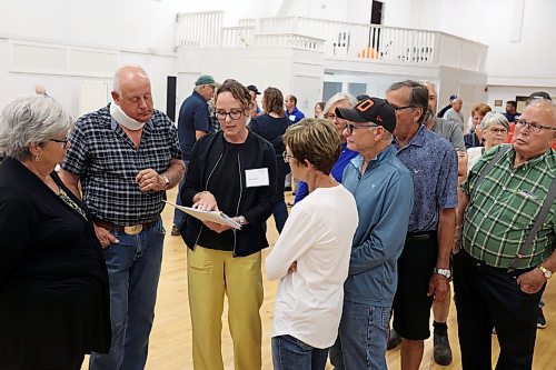 16072024
Kerra Mruss (third from left) with WSP engineering speaks with westman residents during a public open house and consultation regarding Highway 1 and Highway 5 Intersection Improvements at the Carberry Community Memorial Hall on Tuesday evening. 
(Tim Smith/The Brandon Sun)