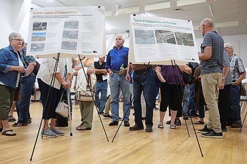 16072024
Al Fehr (C) of Austin, Manitoba looks over proposals during a public open house and consultation regarding Highway 1 and Highway 5 Intersection Improvements at the Carberry Community Memorial Hall on Tuesday evening. 
(Tim Smith/The Brandon Sun)