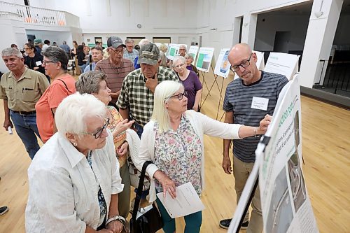 16072024
Donovan Toews (R), Managing Partner with Landmark Planning &amp; Design, speaks with westman residents during a public open house and consultation regarding Highway 1 and Highway 5 Intersection Improvements at the Carberry Community Memorial Hall on Tuesday evening. 
(Tim Smith/The Brandon Sun)