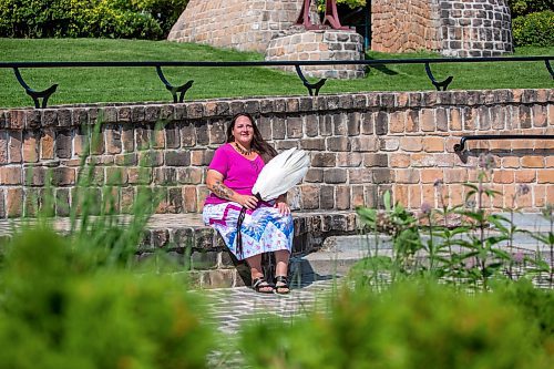 BROOK JONES / FREE PRESS
Jaime Grasby, 43, who is an indigenous story teller and knowledge keeper is pictured with smuding feather fans as she sits in the Oodena Celebration Circle at The Forks in Winnipeg, Man., Thursday, July 11, 2024.