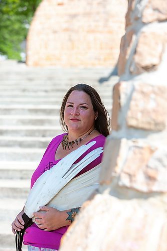 BROOK JONES / FREE PRESS
Jaime Grasby, 43, who is an indigenous story teller and knowledge keeper holds smuding feather fans as she is pictured in the Oodena Celebration Circle at The Forks in Winnipeg, Man., Thursday, July 11, 2024.