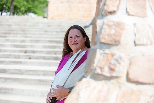 BROOK JONES / FREE PRESS
Jaime Grasby, 43, who is an indigenous story teller and knowledge keeper holds smuding feather fans as she is pictured in the Oodena Celebration Circle at The Forks in Winnipeg, Man., Thursday, July 11, 2024.