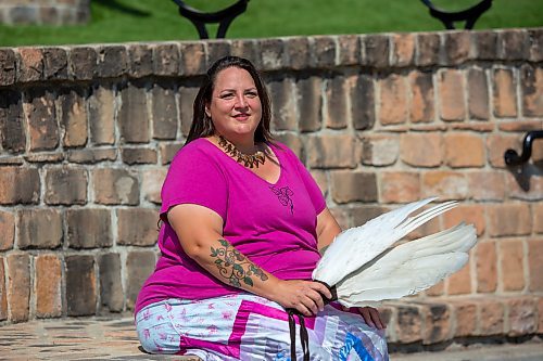 BROOK JONES / FREE PRESS
Jaime Grasby, 43, who is an indigenous story teller and knowledge keeper is pictured with smuding feather fans as she sits in the Oodena Celebration Circle at The Forks in Winnipeg, Man., Thursday, July 11, 2024.