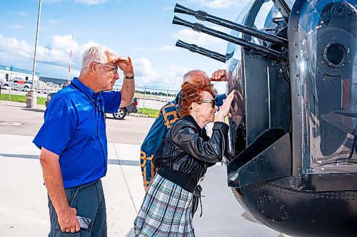 NIC ADAM / FREE PRESS
Paul Orsak (left) and Melva Widdicombe look into the Lancaster at the Royal Aviation Museum of Western Canada on Tuesday afternoon.
240716 - Tuesday, July 16, 2024.

Reporter: Nicole