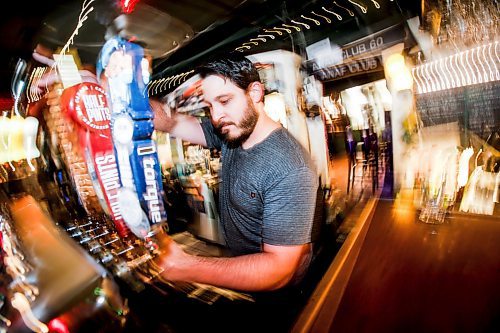 JOHN WOODS / FREE PRESS
Kevin Mazur, bartender/musician, pulls a pint at the ANAF in Osbourne Village Tuesday, July 16, 2024. 

Reporter: