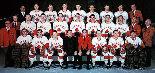 A copy of a postcard  WAYNE GLOWACKI/WINNIPEG FREE PRESS Canada&#x2019;s  Olympic Hockey Team 1967-68 Left to  right: Front row Ken Broderick, Gary Dineen, Gerry Pinder, Father  David Bauer Special Advisor,  Jack McLeod Coach and General Manager, Morris Mott, Fran Huck, Wayne Stephenson. Middle row...Scotty Clark Trainer,Ken Esdale Assistant Trainer, Barry MacKenzie, Terry O&#x2019;Malley, Danny O&#x2019;Shea, Brian Glennie, Steve Monteith, Ted Hargreaves, Jean Cusson, Dr. Reid Taylor,  Dr. Jack Waugh Team Doctors. Back  row... Bud Holohan Education Advisor, Herb Pinder,  Marshall Johnston, Brian Harper, Gary Begg, Ray Cadieux, Billy MacMillan, Paul Conlin,Phil Reimer Publicity Director.       Al Besson story. Sept 29 2006