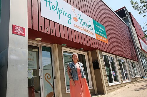 Amanda Bray, executive director of Helping Hands Soup Kitchen, stands outside of the non-profit organization's building. Repairs are underway to install new ovens for the kitchen that provides free meals five days a week. (Geena Mortfield/The Brandon Sun)