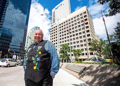 MIKAELA MACKENZIE / FREE PRESS

David Chartrand, president of the Manitoba M&#xe9;tis Federation, in front their new property acquisitions on Wednesday, July 17, 2024. The MMF bought the two Bell MTS branded towers (and a parking lot) in downtown Winnipeg near Portage &amp; Main. 

For Gabby story.

