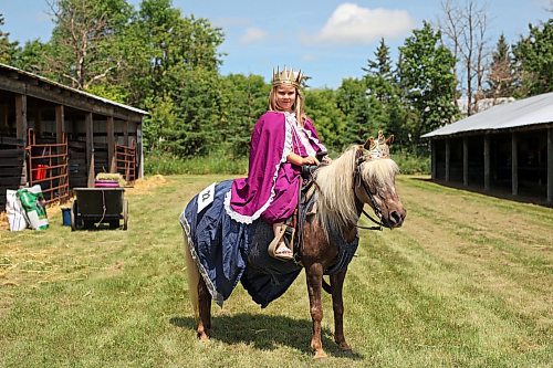 Six-year-old Victoria Thiessen of Griswold atop her pony Sally Rose after competing in the miniature horse judging seven-and-under costume class at the Shoal Lake Ag Society Fair on Wednesday. (Tim Smith/The Brandon Sun)