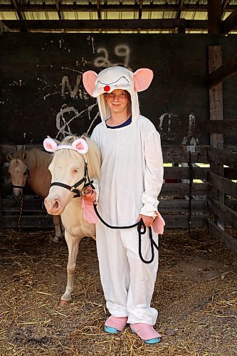 Lainey Betteridge of Minnedosa and her miniature horse Pinky after competing in the miniature horse judging costume class. (Tim Smith/The Brandon Sun)