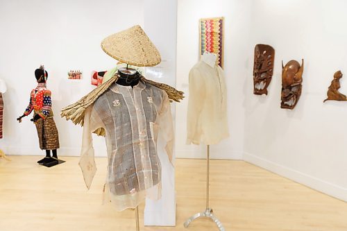 MIKE DEAL / FREE PRESS
This ensemble depicts the traditional clothing of a Filipino working class male in the early 20th century. The woven rattan hat and anahaw cape protects the person from the heat and rain. 
The Lupa ay Buhay | Land is Life, exhibition showcasing Filipino culture through its rich craft traditions. The exhibit will be on display August 28, 2024 at the Shirley Richardson Craft Gallery on 329 Cumberland Avenue.
240717 - Wednesday, July 17, 2024.