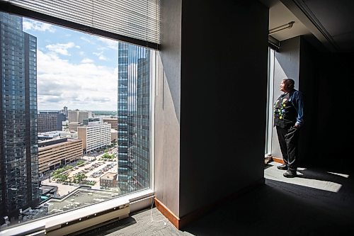 MIKAELA MACKENZIE / FREE PRESS

David Chartrand, president of the Manitoba Mtis Federation, checks out the view from 333 Main St. on Wednesday, July 17, 2024. The MMF bought the two Bell MTS branded towers (and a parking lot) in downtown Winnipeg near Portage &amp; Main. 

For Gabby story.

