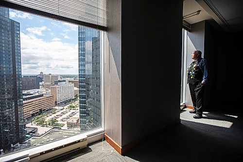 MIKAELA MACKENZIE / FREE PRESS

David Chartrand, president of the Manitoba Mtis Federation, checks out the view from 333 Main St. on Wednesday, July 17, 2024. The MMF bought the two Bell MTS branded towers (and a parking lot) in downtown Winnipeg near Portage &amp; Main. 

For Gabby story.

