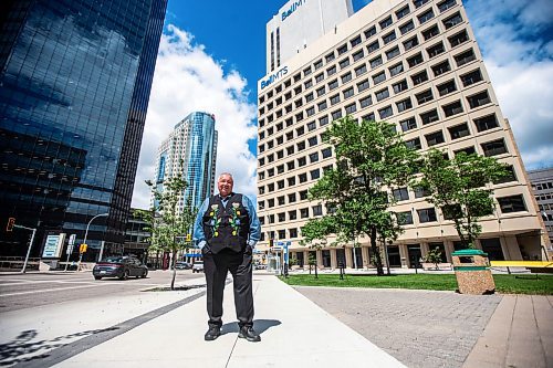 MIKAELA MACKENZIE / FREE PRESS

David Chartrand, president of the Manitoba Mtis Federation, in front their new property acquisitions on Wednesday, July 17, 2024. The MMF bought the two Bell MTS branded towers (and a parking lot) in downtown Winnipeg near Portage &amp; Main. 

For Gabby story.

