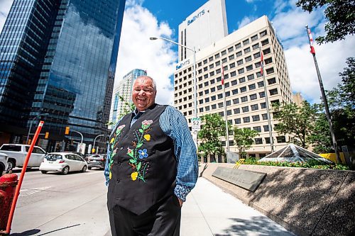 MIKAELA MACKENZIE / FREE PRESS

David Chartrand, president of the Manitoba Mtis Federation, in front their new property acquisitions on Wednesday, July 17, 2024. The MMF bought the two Bell MTS branded towers (and a parking lot) in downtown Winnipeg near Portage &amp; Main. 

For Gabby story.

