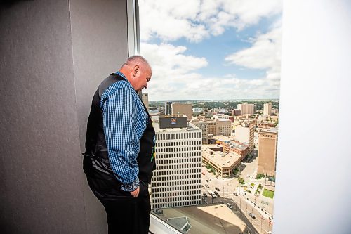 MIKAELA MACKENZIE / FREE PRESS

David Chartrand, president of the Manitoba Mtis Federation, checks out the view from 333 Main St. on Wednesday, July 17, 2024. The MMF bought the two Bell MTS branded towers (and a parking lot) in downtown Winnipeg near Portage &amp; Main. 

For Gabby story.

