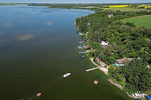 17072024
A boat pulls a group of people on a tube across Shoal Lake on a sunny and hot Wednesday afternoon. 
(Tim Smith/The Brandon Sun)default