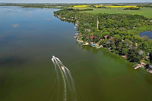 17072024
A boat pulls a group of people on a tube across Shoal Lake on a sunny and hot Wednesday afternoon. 
(Tim Smith/The Brandon Sun)default