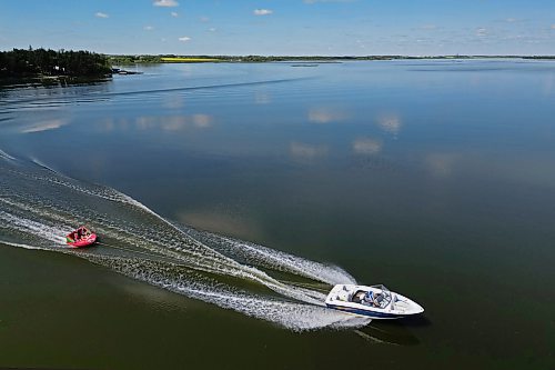 17072024
A boat pulls a group of people on a tube across Shoal Lake on a sunny and hot Wednesday afternoon. 
(Tim Smith/The Brandon Sun)default