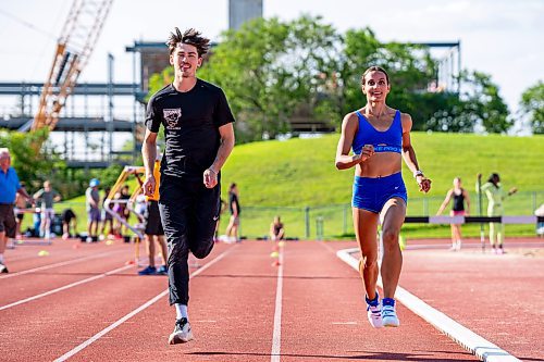 NIC ADAM / FREE PRESS
Daxx Turner (left) and Madisson Lawrence pictured running on the track at the University of Manitoba track stadium Wednesday afternoon.
240717 - Wednesday, July 17, 2024.

Reporter:
