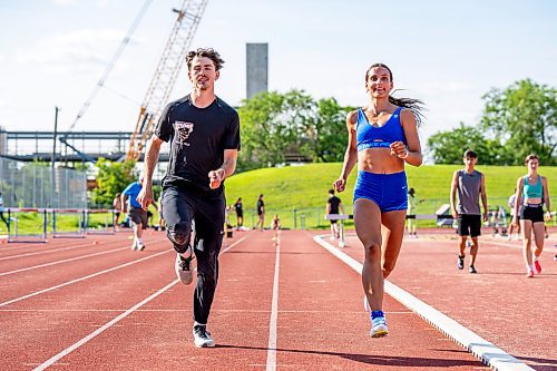 NIC ADAM / FREE PRESS
Daxx Turner (left) and Madisson Lawrence pictured running on the track at the University of Manitoba track stadium Wednesday afternoon.
240717 - Wednesday, July 17, 2024.

Reporter:
