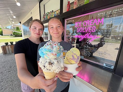 Chloe Williment, left, from Oake Lake holds a double cone with scoops of chocolate chip cookie dough and birthday party ice cream, while her friend Molly Struder from Virden chose a cup of lavender lemonade on a bright and sunny Wednesday afternoon at Joe Dandy's Drive-In at Oak Lake. Over the next several editions of Westman This Week, we'll visit some great little ‘treateries.’ See Page 8 for the first story in the series. (Matt Goerzen/The Brandon Sun)