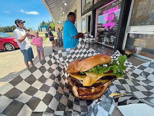 The Big Mike, described as "the ultimate hungry man's burger" by the owners of Joe Dandy's Drive-In, is made with two four-ounce beef patties topped with bacon, cheese, lettuce, crispy onions, tomato and the restaurant's tangy Dandy sauce on a brioche bun. Definitely worth stopping for.  (Matt Goerzen/The Brandon Sun)