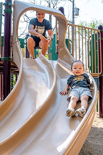 NIC ADAM / FREE PRESS
Cliff Tesoro, and his two-year-old son Castiel, have fun at St. Vital Park’s playground Thursday afternoon.
240718 - Thursday, July 18, 2024.

Reporter: ?