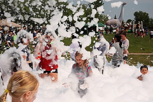 Kids beat the heat playing in a foam party during the Hamiota Agricultural Society Fair on a hot Thursday afternoon. See more photos from the fair on Page A3. (Tim Smith/The Brandon Sun)