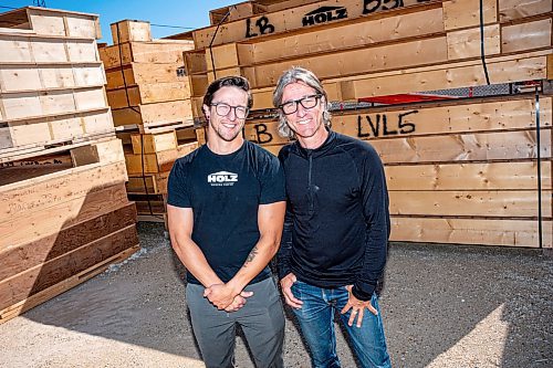 NIC ADAM / FREE PRESS
Ted Geddert (right), founder and president of Holz, pictured infront of prefab pieces at his business with his son and general manager Aaron Geddert Thursday morning.
240718 - Thursday, July 18, 2024.

Reporter: Aaron